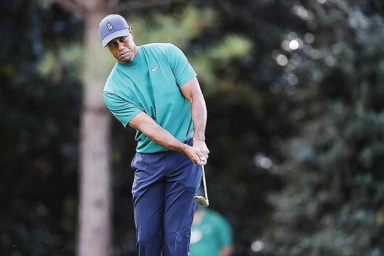 Tiger Woods playing a shot during a practice round on Monday before the start of the Masters tomorrow. The 15-time Major champion needs three more Majors to tie Jack Nicklaus' record of 18.