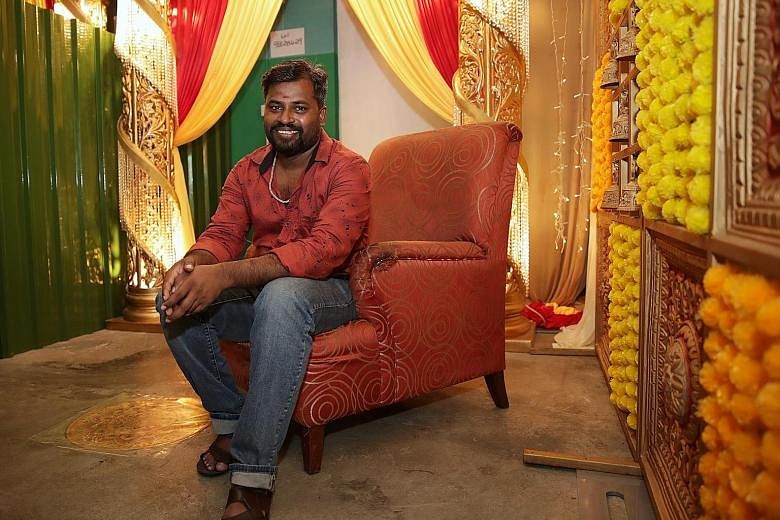 Mr Nallamarudhu Muniasami beside the Deepavali decorations at his dormitory in Tuas View Square, where he stays with about 70 other workers. His boss, Ms Joey Tan of McKnight Engineering, hopes that the festive transformation would give the workers s