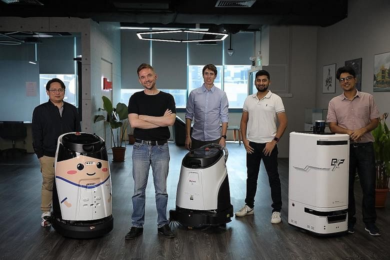 Cognicept Systems co-founder and CEO Michael Sayre (in black T-shirt) with (from left) corporate finance manager Gary Ong, robotics engineers Jakub Tomasek and Swarooph Seshadri, and co-founder and chief technology officer Alok Pathak. The firm has c