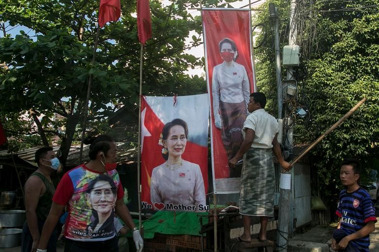 Supporters of the National League for Democracy with banners of Myanmar State Counsellor Aung San Suu Kyi on Tuesday.