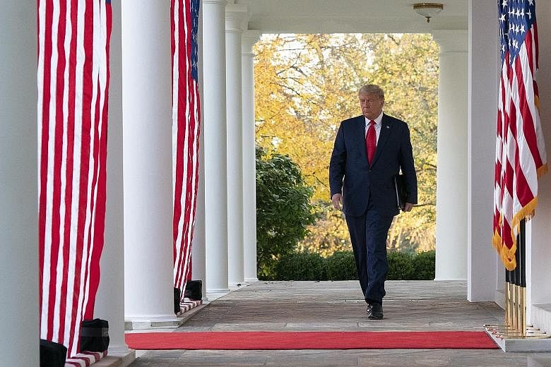 US President Donald Trump arriving to speak in the Rose Garden at the White House on Friday. In comments on the coronavirus pandemic that has rocked the country, he said he expects an emergency use authorisation for Pfizer's vaccine "extremely soon".