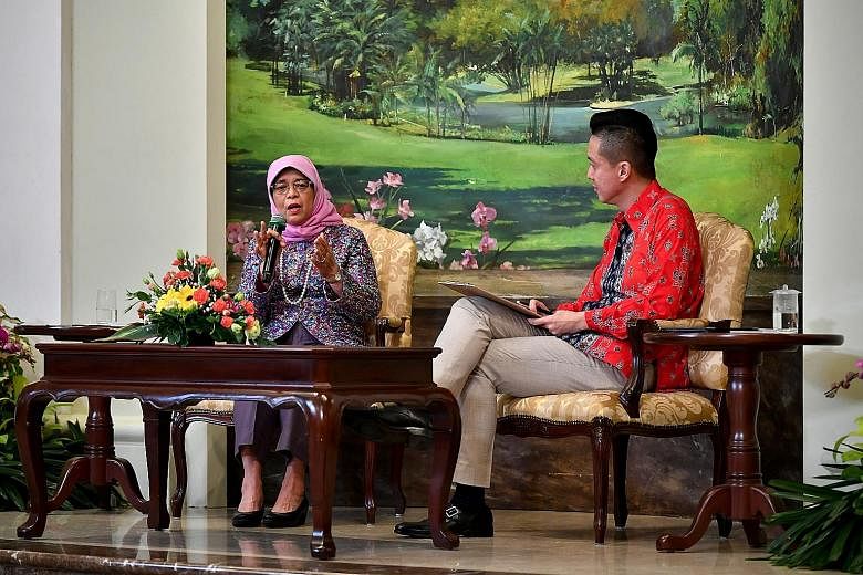 President Halimah Yacob with emcee Richardo Chua, 38, during the Facebook Live session which was filmed inside the Istana Banquet Hall yesterday. ST PHOTO: LIM YAOHUI