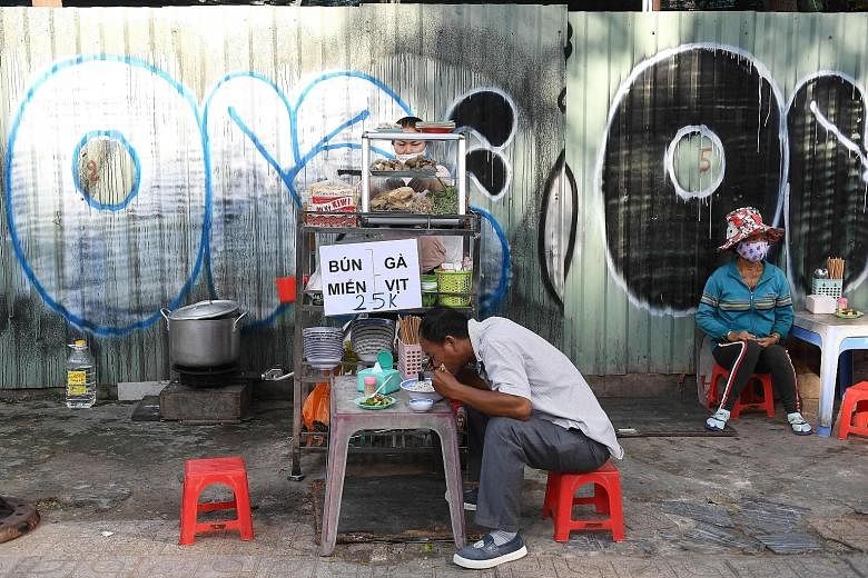 A noodle soup stall along a sidewalk in Vietnam's Ho Chi Minh City. The country's fragrant noodle soups and fresh spring rolls have won fans worldwide but rising food safety scandals are sparking concerns among Vietnamese about what they eat.