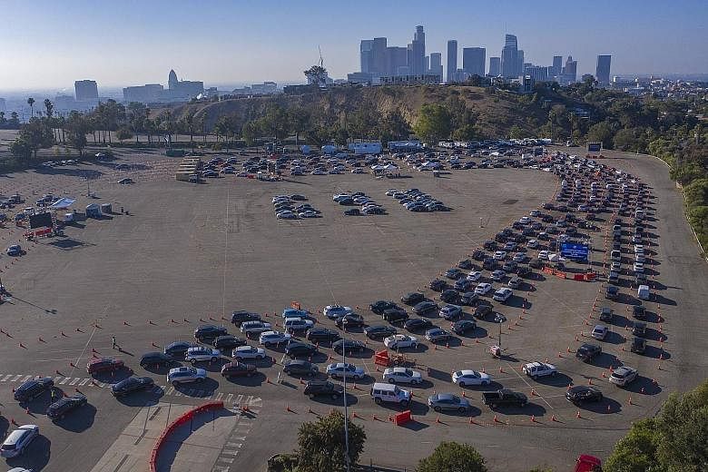 Motorists queueing for Covid-19 testing last Saturday at Dodger Stadium in Los Angeles. The United States, which has the world's highest absolute tolls from the pandemic, on Sunday added one million new infections to its tally in less than a week, ac