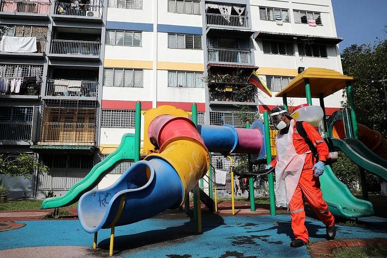 A worker disinfecting a playground in Kuala Lumpur. Under the more relaxed CMCO, which covers nine of Malaysia's 13 states and all three federal territories - Kuala Lumpur, Putrajaya and Labuan - the public can still travel to work and shop but canno