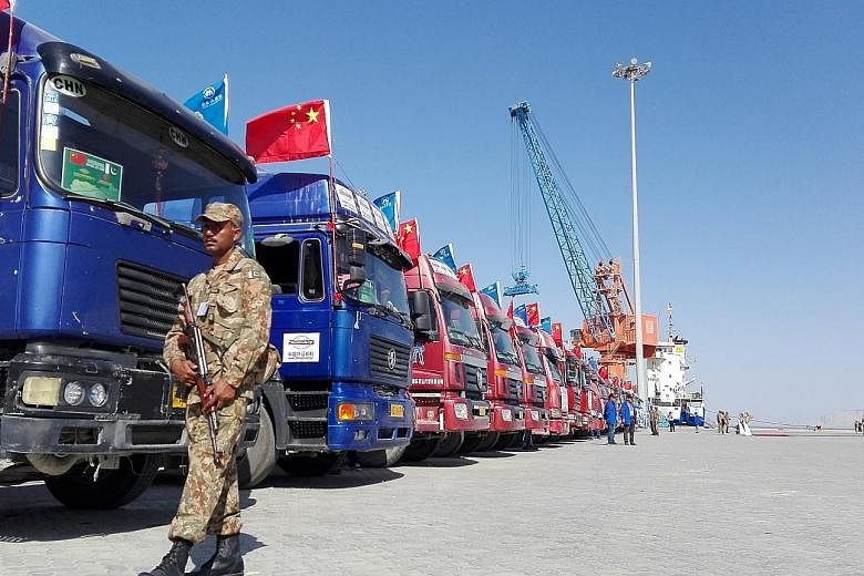 A 2016 photo of Chinese trucks parked at Pakistan's Gwadar port. Gwadar is strategically important because of its closeness to the Strait of Hormuz, the cross junction of vital international shipping routes.