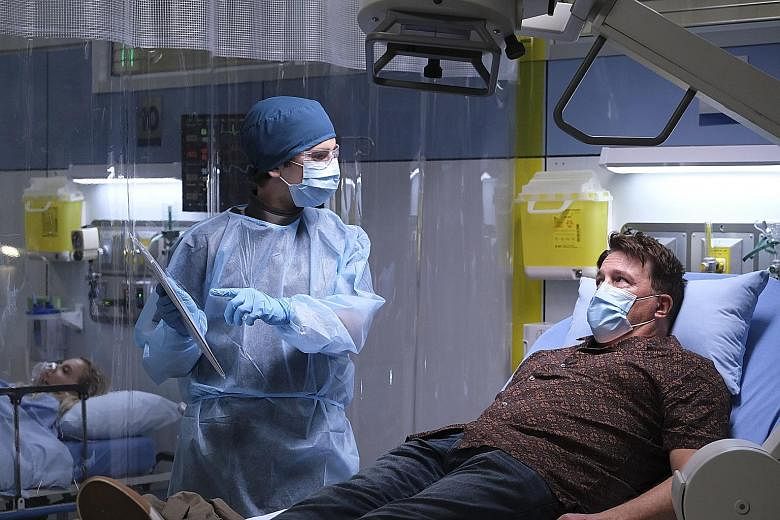 Dr Shaun Murphy, played by Freddie Highmore (left), treats a patient during the early days of the Covid-19 pandemic in the drama The Good Doctor.