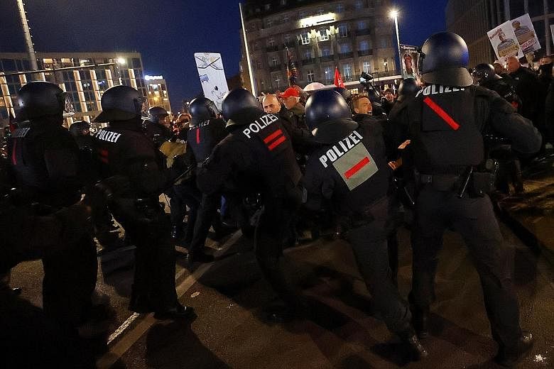 Protesters scuffling with police in Leipzig on Nov 7 at a rally against the German government's coronavirus restrictions. The number of uprisings globally has been increasing by an average of 11.5 per cent a year since 2009. PHOTO: REUTERS