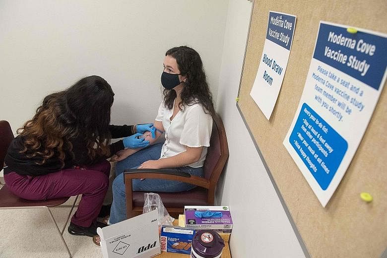 A volunteer in Detroit, Michigan, being tested before being given Moderna's Covid-19 vaccine in August. The US drugmaker announced on Monday that its experimental vaccine has been found to be 94.5 per cent effective. The vaccine can also be kept in o