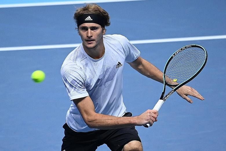 German Alexander Zverev returning to Diego Schwartzman in their ATP Finals match yesterday. He stayed in the event with a three-set win but the Argentinian's chances are gone.