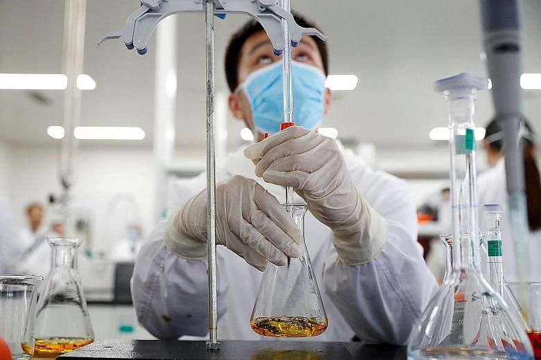 A researcher in a Sinovac Biotech laboratory in Beijing. The Chinese firm's CoronaVac and four other vaccines developed in China are undergoing late-stage trials to determine their effectiveness in preventing Covid-19.