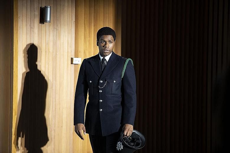 In the film Red, White And Blue, John Boyega (left) plays Leroy Logan, a forensics scientist who becomes a police officer after Logan's father is assaulted by two white officers acting on racist impulses. The film, which is based on a true story, is 