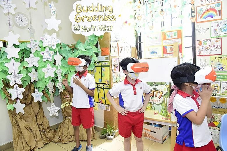Pre-schoolers at PCF Sparkletots @ Yew Tee Block 690D experiencing virtual reality while learning about sustainability in the Budding Greenies @ North West learning programme.