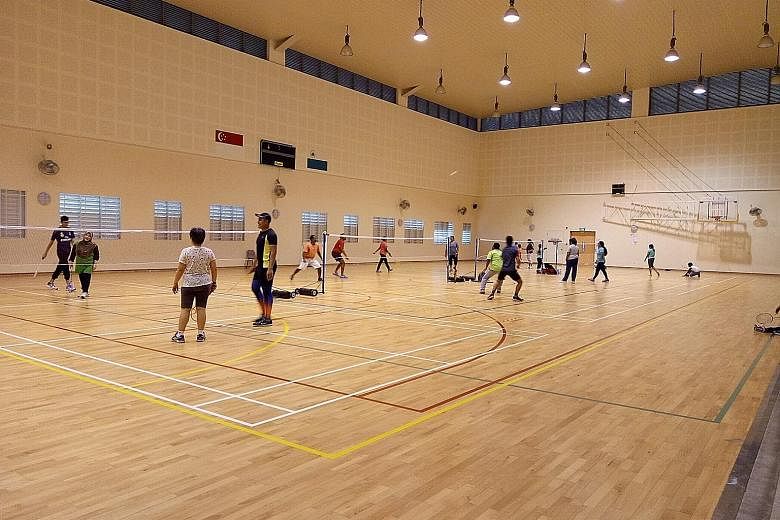 Members of the public playing badminton at the indoor hall of East Spring Primary School, before the Covid-19 pandemic. The hall is one of 169 facilities under the Dual-Use Scheme that will be reopened to the public during the year-end school holiday