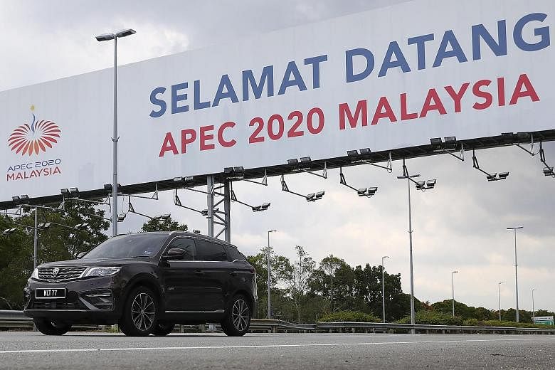 A billboard in Sepang marking the Asia-Pacific Economic Cooperation (Apec) summit, which is chaired by Malaysia this year. Apec economies are working with Malaysia to finalise two outcome documents for tomorrow's virtual Economic Leaders' Meeting: th