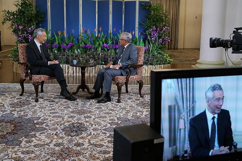 Prime Minister Lee Hsien Loong (left) and Singapore Business Federation chief executive Ho Meng Kit at the virtual Apec CEO Dialogues event. At the dialogue, PM Lee said he does not see Singapore, in the short term, escaping overnight from the precau