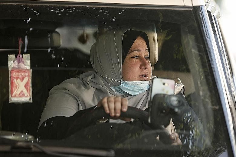 Ms Naela Abu Jibba, who has a degree in community service, started her taxi business after failing to find work. She gets a lot of sexist jibes about her driving abilities, but encouraging comments are far greater in number.