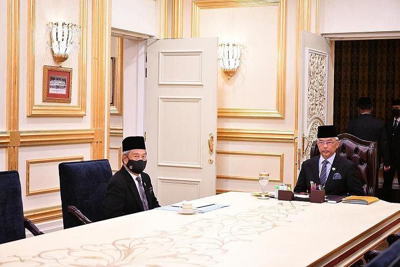 Prime Minister Muhyiddin Yassin (left) with King Sultan Abdullah Ahmad Shah on Wednesday. Sultan Abdullah has advised all lawmakers to approve in an upcoming vote next year's budget in the interests of Malaysia.