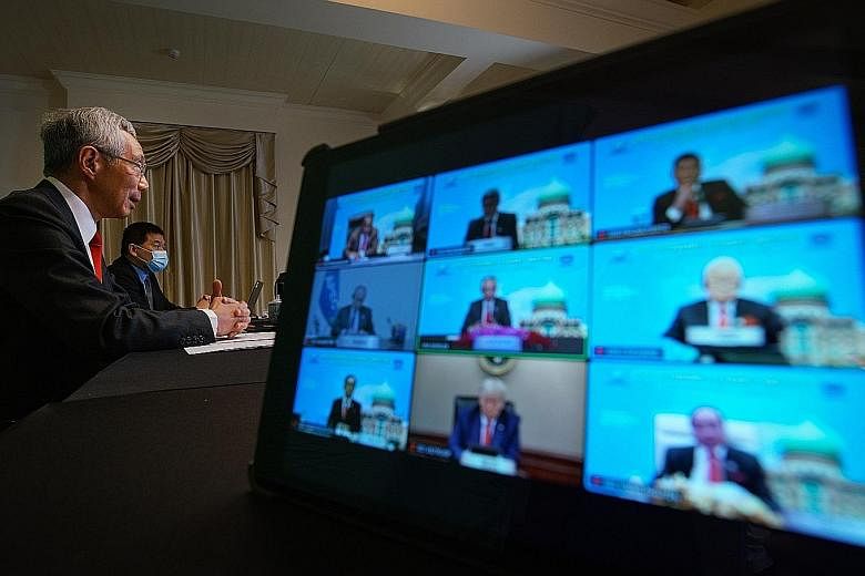 Prime Minister Lee Hsien Loong at the virtual Apec meeting yesterday. Other leaders who joined the virtual summit included Japan's Prime Minister Yoshihide Suga, Russian President Vladimir Putin, Canadian Prime Minister Justin Trudeau and New Zealand
