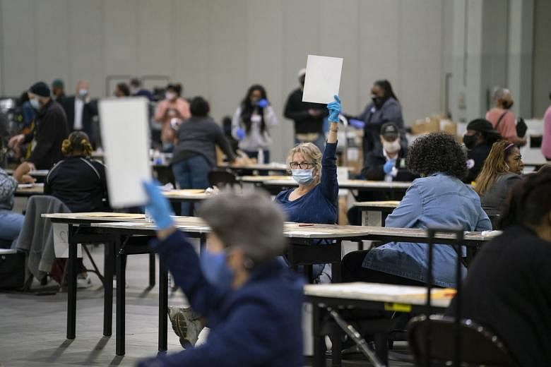 Election workers recounting ballots in Atlanta in the US state of Georgia last Saturday. The painstaking six-day recount by hand of five million ballots affirmed that President-elect Joe Biden was the winner in the state.