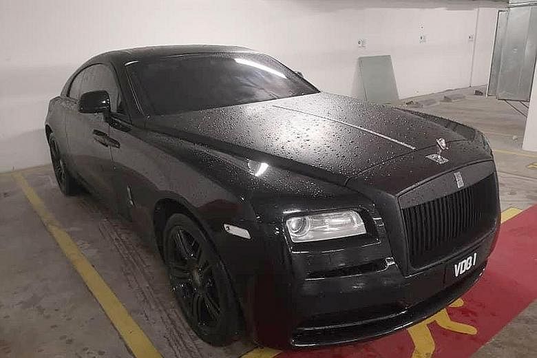A Rolls-Royce Phantom (left, top) and a Mustang were among luxury cars seized by graft busters investigating a criminal syndicate involving immigration officers in Malaysia. The syndicate is believed to be involved in international human trafficking.