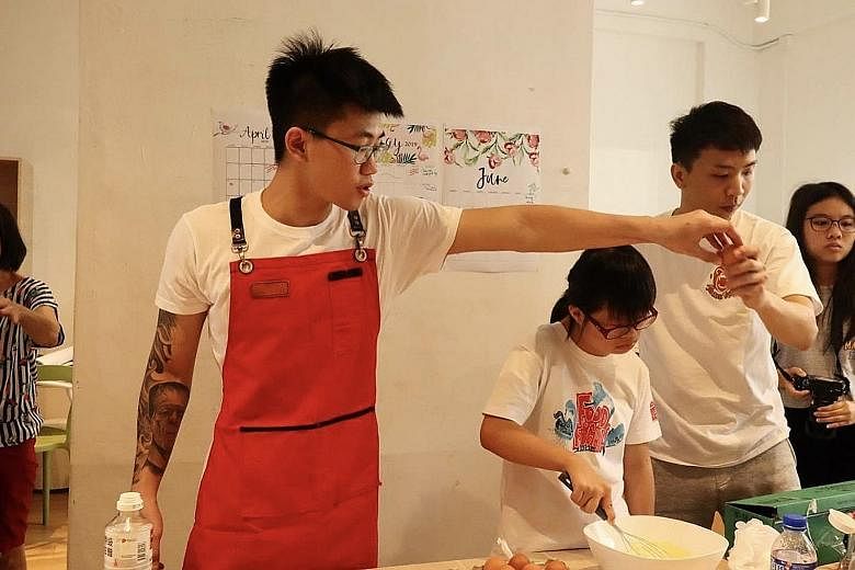 Jason (left) and Zhen Long conducting a confidence-building workshop last year for children with special needs from Club Rainbow.