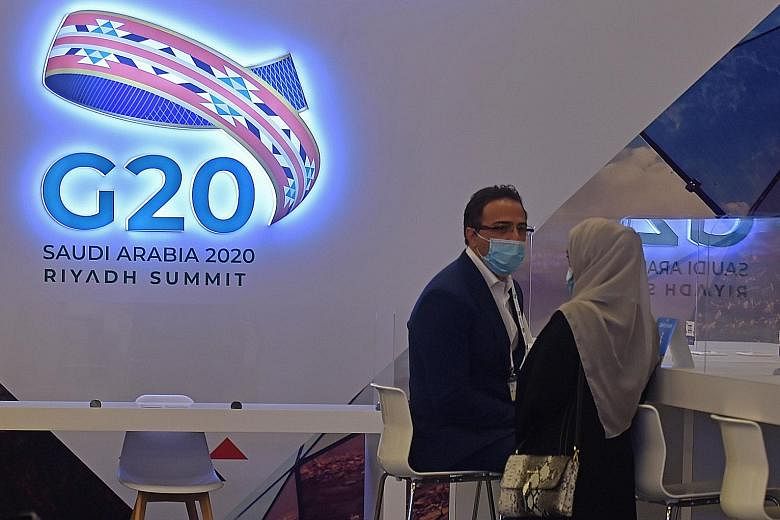Journalists in an almost empty media room last Friday in Riyadh set up for the coverage of the G-20 summit, which is being held virtually due to the coronavirus pandemic. A physical summit would have been an opportunity to showcase Saudi Arabia's amb