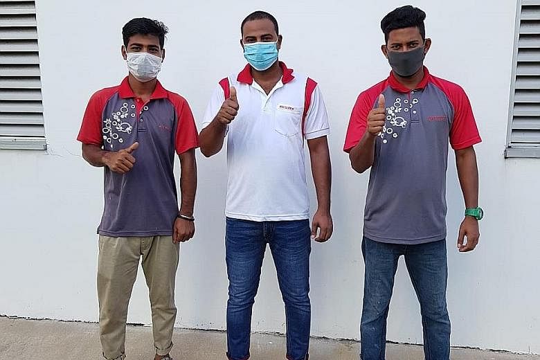 From far left: Mr Easin Mohammad, Mr Hossan Mohammad Saddam and Mr Biswas Md Wasim were among those who rushed to help a couple caught in a fire at their flat.