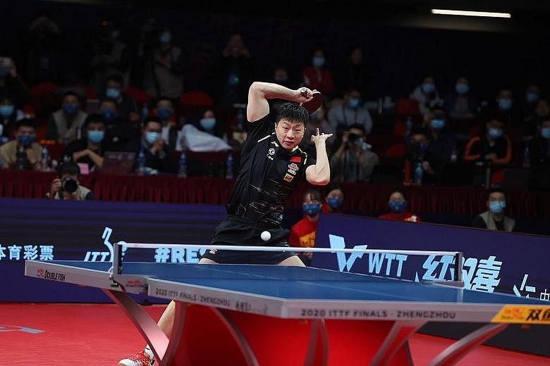 Ma Long hitting a forehand against Chinese compatriot Fan Zhendong in Zhengzhou. He won a record-extending sixth ITTF Finals title.