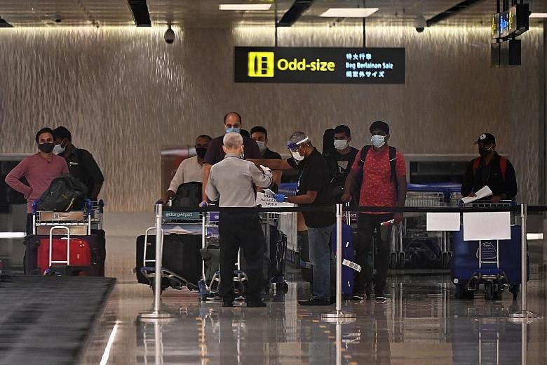 Passengers arriving at Changi Airport Terminal 1 earlier this month. The air travel bubble with Hong Kong was slated to launch with one flight into each city and each flight with a maximum capacity of 200 passengers. On Saturday evening, it was annou