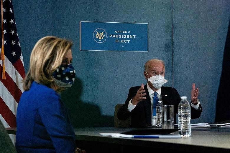 President-elect Joe Biden and House Speaker Nancy Pelosi at a meeting last Friday. Many of Mr Biden's advisers are convinced that deteriorating economic conditions from the Covid-19 outbreak and the looming threat of millions of Americans losing thei