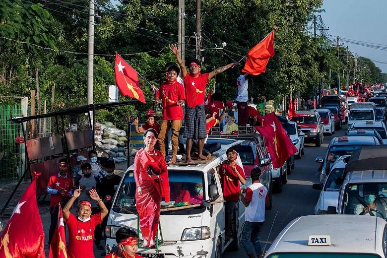 Supporters of the National League for Democracy party celebrating with a cut-out figure of Myanmar state counsellor Aung San Suu Kyi in Yangon on Nov 10. The party secured a landslide victory despite the government's weak performance on its key pledg