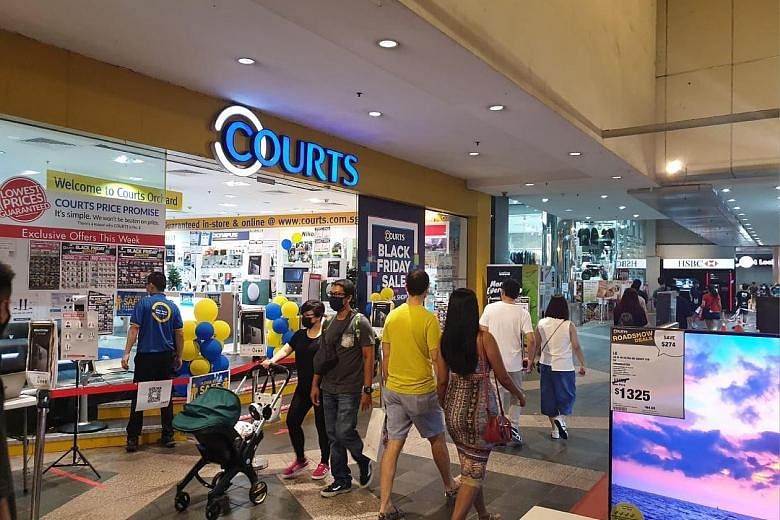 Retailers such as Courts (left) and BHG, which has a Beauty Library (above) at its Bugis branch, are offering shopping vouchers to readers for Black Friday & Cyber Monday sales.