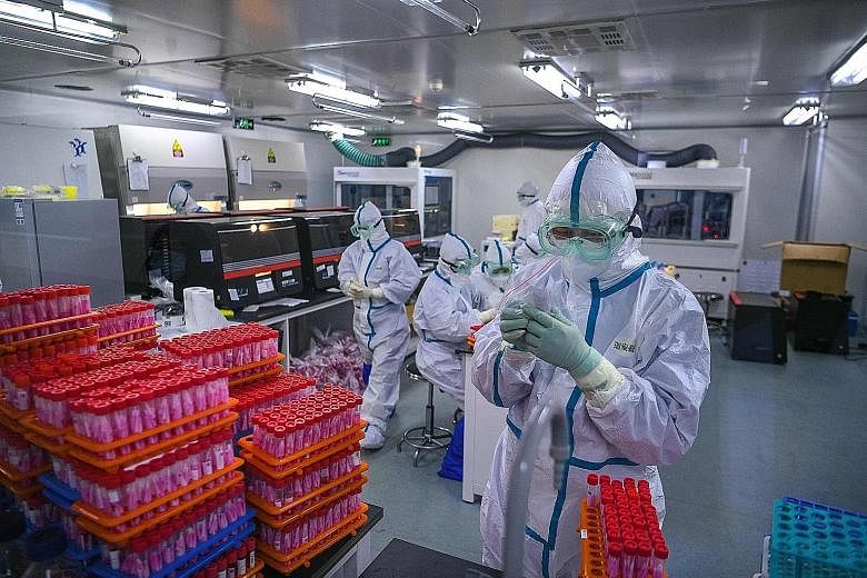 Technicians processing Covid-19 tests in a laboratory in Tianjin, China. China National Biotec Group (CNBG) has submitted an application to Chinese regulators to bring its Covid-19 vaccine to the market. With the application, CNBG will likely become 