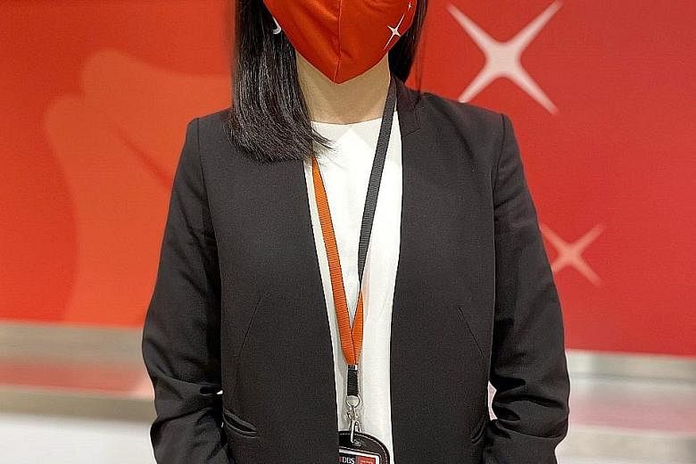 Former flight stewardess Brinda Cheng, a wealth planning manager at DBS' Bishan branch, is among over 2,000 people the bank hired this year.
