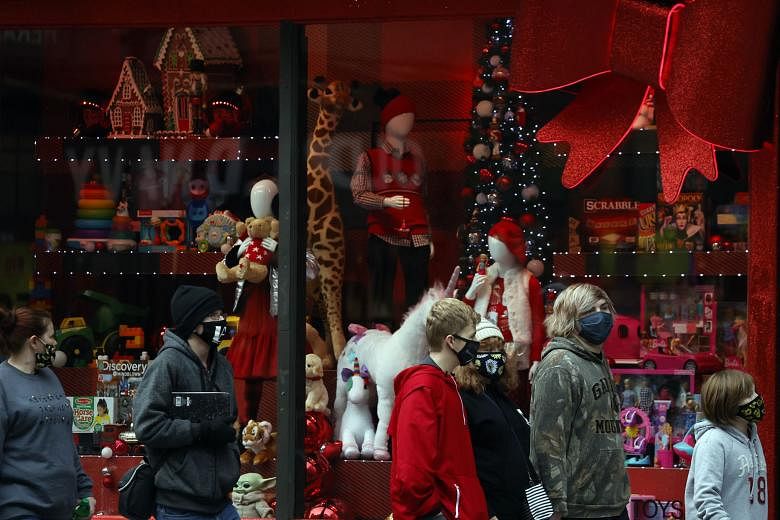 Macy's Christmas windows in New York City. US President-elect Joe Biden is said to be considering former Fed vice-chair Roger Ferguson and BlackRock executive Brian Deese to be his top White House economic adviser, according to people familiar with t