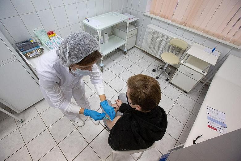 A patient getting Russia's Covid-19 vaccine - Sputnik V - during a trial in Moscow this week. The speed at which Covid-19 vaccines are being developed worldwide has been described as incredible and extraordinary. It is an unprecedented pace made poss