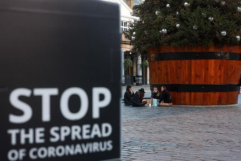 A Covid-19 alert message in London's Covent Garden last week. Britain has had about 1.6 million coronavirus cases and over 57,500 deaths.