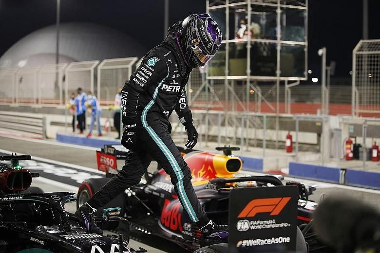 Lewis Hamilton has a spring in his step after breaking the Sakhir track record in 1:27.264. PHOTO: REUTERS