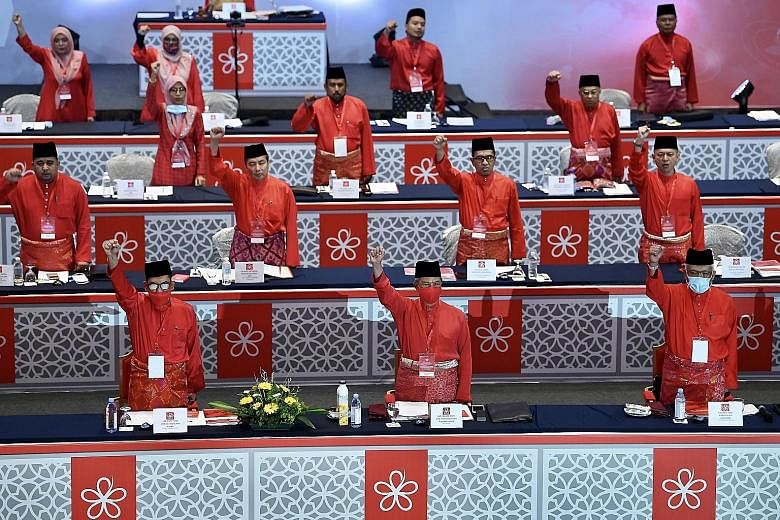Parti Pribumi Bersatu Malaysia president Tan Sri Muhyiddin Yassin (front row, centre) at the party's annual general assembly yesterday. His Perikatan Nasional government's budget got past the second reading last week. PHOTO: BERNAMA