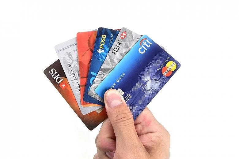Some people end up having several credit cards and spending on a whim. The result is that quite a number of them cannot afford to pay their credit card bills on time, not even the interest, says the writer. ST FILE PHOTO