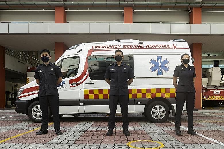 A Singapore Civil Defence Force (SCDF) paramedic flanked by private ambulance operator crew members. From today, paramedics from Unistrong Technology and Lentor Ambulance will respond to complex medical emergencies in SCDF ambulances and will be wear