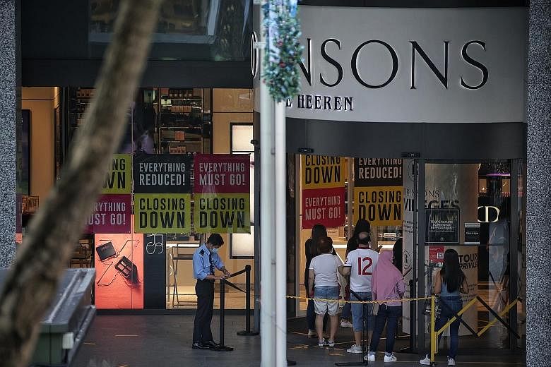 Shoppers queueing to enter Robinsons at The Heeren. The department store is closing down its last two stores here and owes at least $31.7 million to more than 440 creditors. ST PHOTO: KEVIN LIM