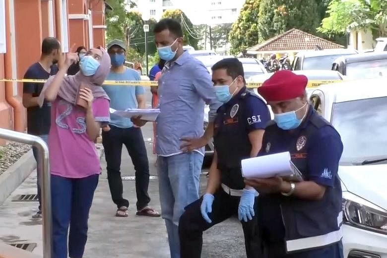 A video clip showing Malaysian policemen at the apartment block in Danau Kota, Setapak, where a man was said to have thrown his four-year-old step-grandson from the third storey in a fit of rage. PHOTO: THE STAR ONLINE/ ASIA NEWS NETWORK
