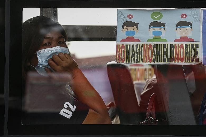 People must still wear masks and face shields and observe social distancing in Metro Manila (left), Davao and six other areas for the whole of this month, while less stringent restrictions will be enforced for the rest of the country.