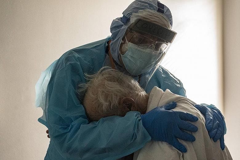 Dr Joseph Varon, chief of staff at United Memorial Medical Centre in Houston, Texas, hugging the elderly man in the viral photo taken on Thanksgiving Day last Thursday. The doctor said the isolation of the Covid-19 intensive care unit was difficult f