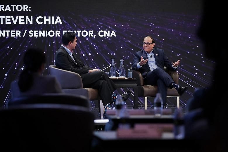 Communications and Information Minister S. Iswaran with the moderator, CNA's Steven Chia, at the opening ceremony of the Asia TV Forum & Market and ScreenSingapore at Marina Bay Sands' Hybrid Broadcast Studio yesterday. This was held as part of the a
