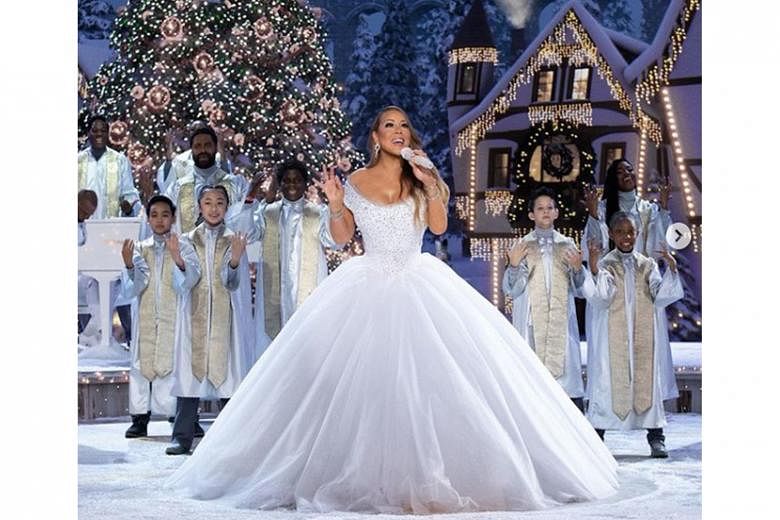 The pop diva (left) performs with guest stars Ariana Grande and Jennifer Hudson in Mariah Carey's Magical Christmas Special.
