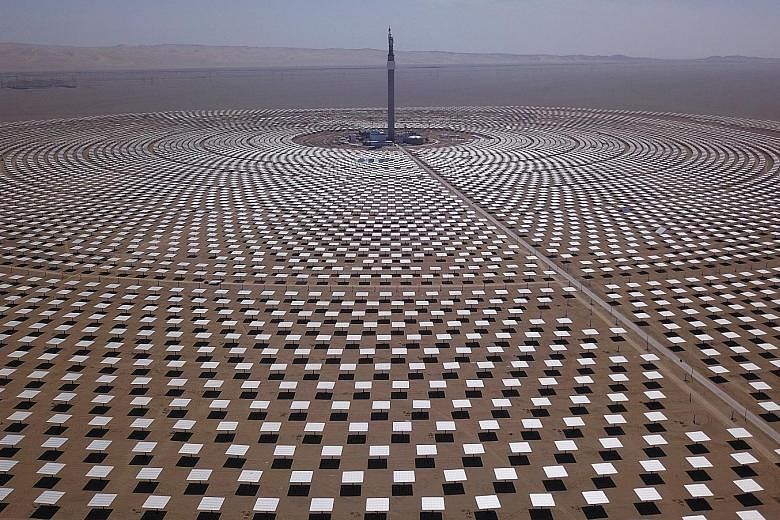 A 2018 photo of the molten-salt solar thermal power plant in Dunhuang in China's Gansu province. The country has pledged to slash its carbon footprint to zero by 2060. An analysis has found that if this is achieved, it will reduce the end of century 