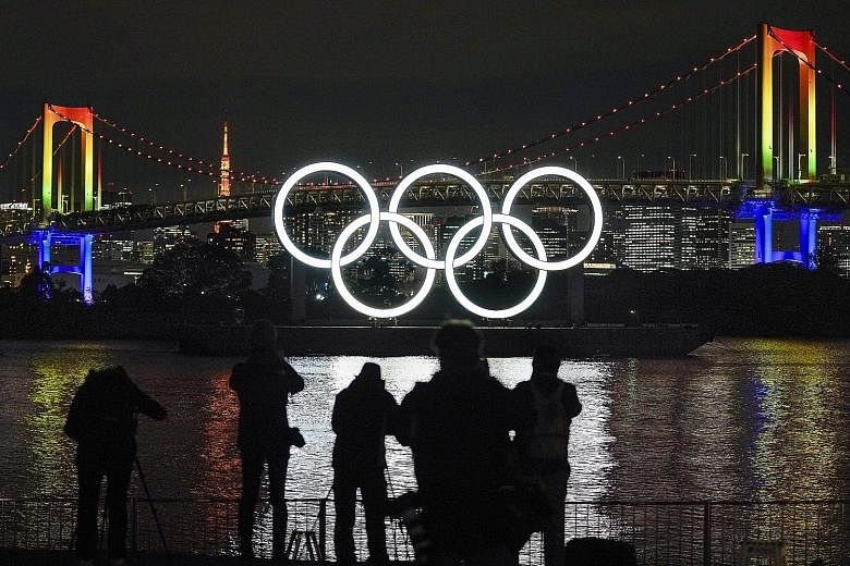 The Olympic rings have been reinstalled at their original location at the Odaiba Marine Park in Tokyo, with the rearranged Summer Games scheduled to go ahead next July.